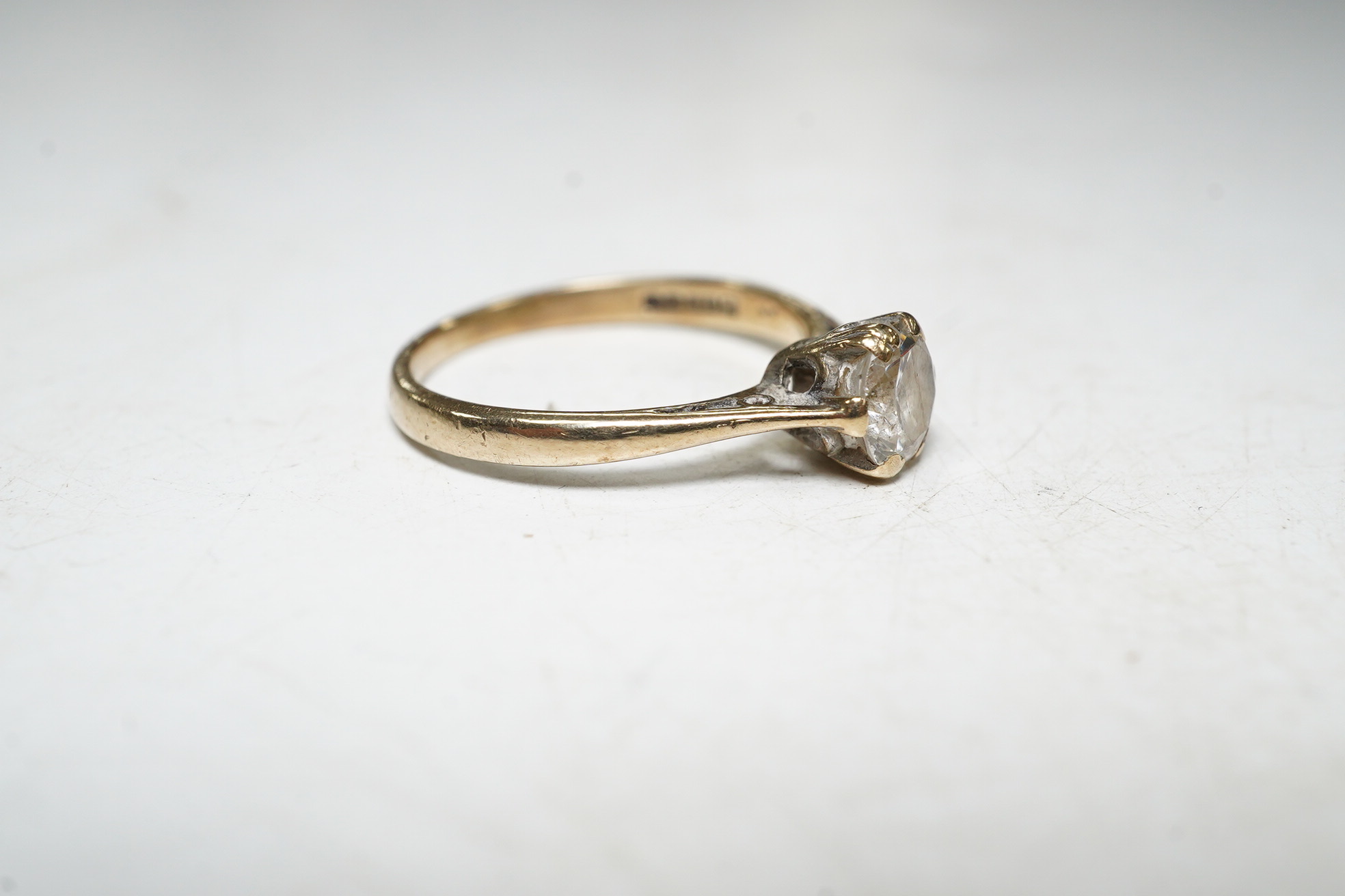 A 9ct gold solitaire diamond ring, size L, 1.8 grams. Condition - fair